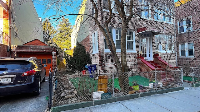 view of front of house with brick siding and fence