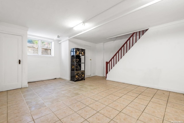 basement featuring light tile patterned floors