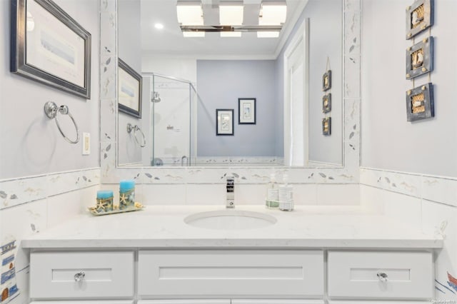 bathroom featuring vanity and an enclosed shower