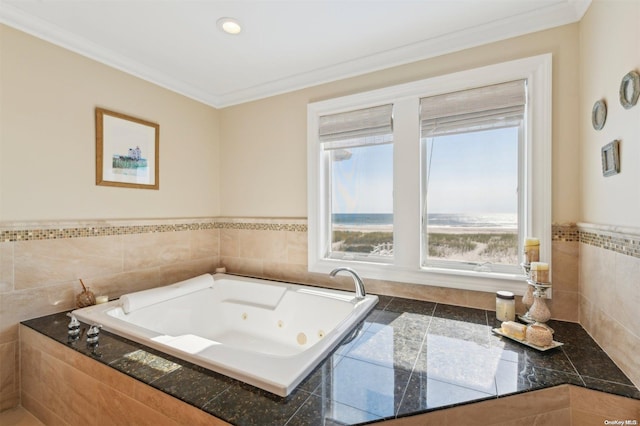 bathroom with crown molding and tiled tub