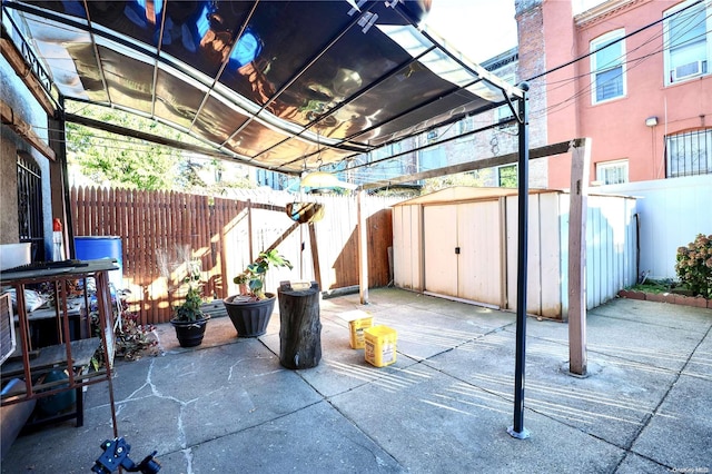 view of patio with a shed