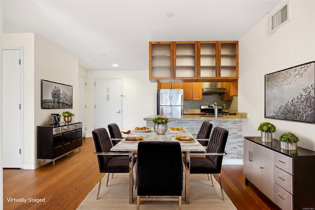 dining room with light wood-type flooring