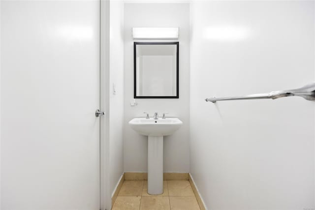 bathroom with tile patterned flooring and sink