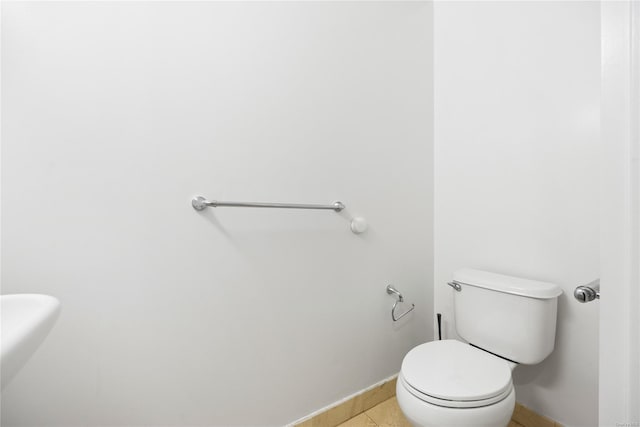 bathroom featuring tile patterned floors and toilet