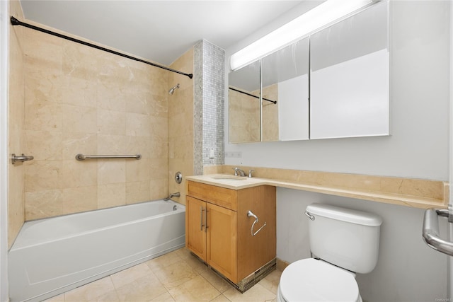 full bathroom featuring tiled shower / bath combo, vanity, tile patterned floors, and toilet