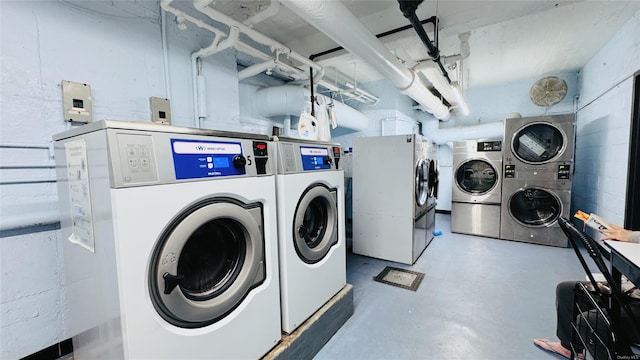 clothes washing area with washer and dryer