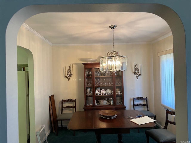 carpeted dining area with a notable chandelier and ornamental molding