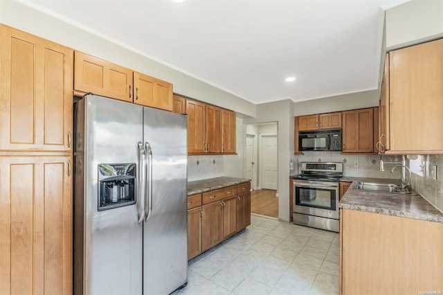 kitchen featuring sink, stainless steel appliances, tasteful backsplash, crown molding, and light tile patterned floors