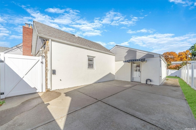 back of property with a patio area