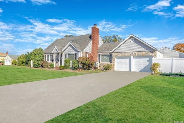 view of front of house featuring a front yard and a garage