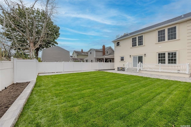 exterior space featuring a yard and central AC unit