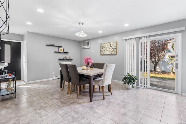 tiled dining space with a baseboard radiator and a wall mounted AC