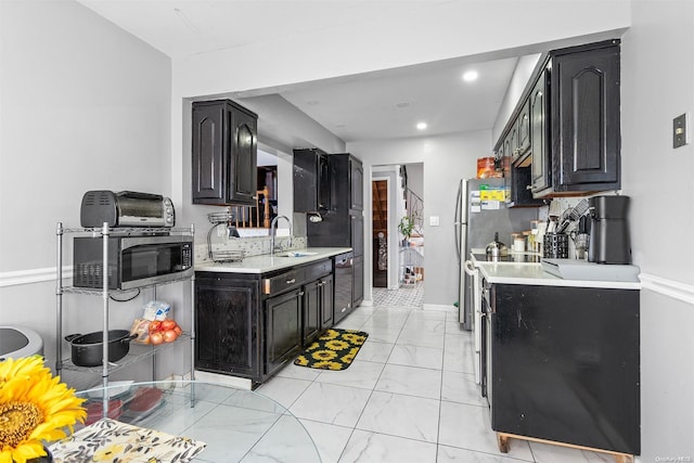 kitchen featuring black dishwasher and sink