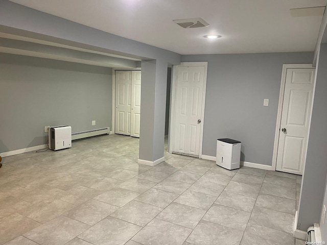 basement featuring baseboard heating