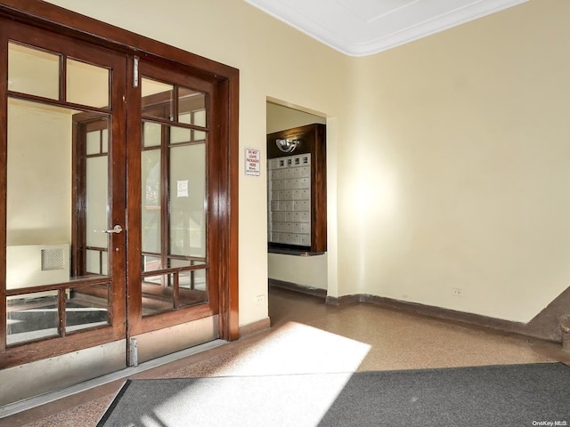 interior space featuring mail boxes and ornamental molding