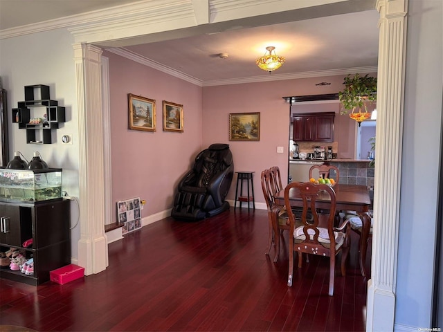 dining space with dark hardwood / wood-style flooring, decorative columns, and crown molding