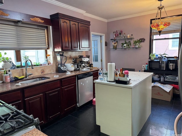 kitchen with decorative light fixtures, plenty of natural light, dishwasher, and sink