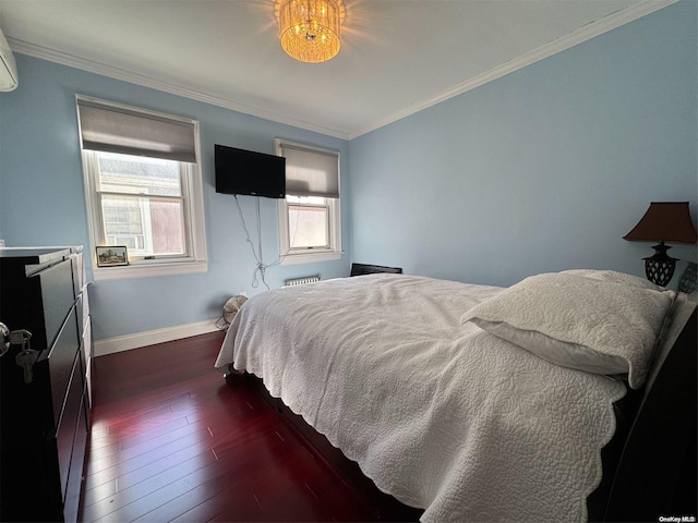 bedroom with ornamental molding, dark hardwood / wood-style floors, and multiple windows