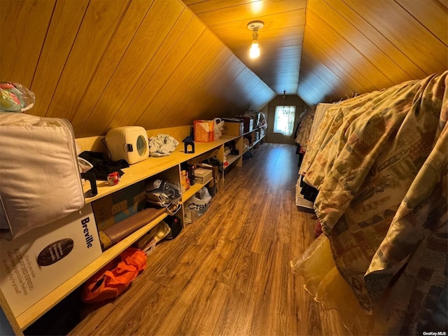 bonus room with vaulted ceiling and hardwood / wood-style floors