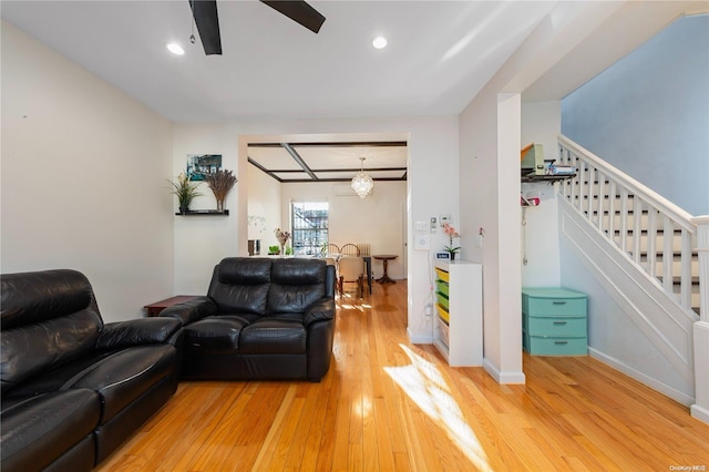 living room with ceiling fan and light wood-type flooring