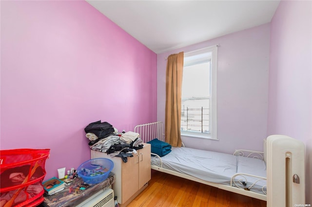 bedroom with light hardwood / wood-style flooring