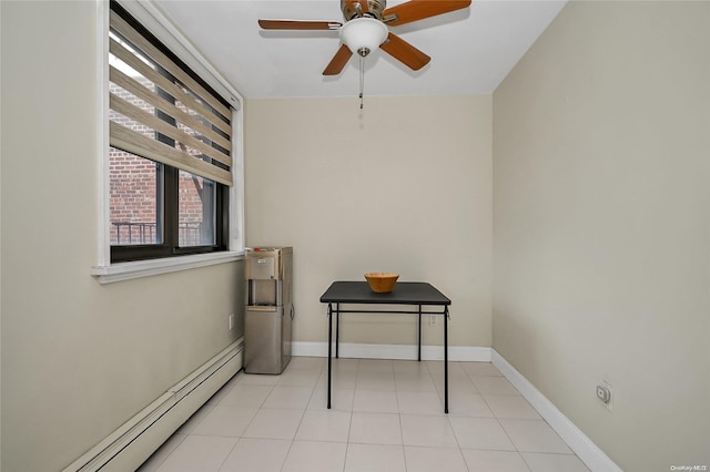 interior space with baseboard heating and ceiling fan