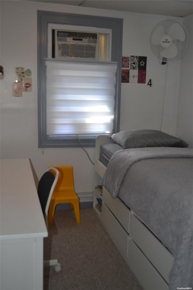 carpeted bedroom with a wall mounted air conditioner