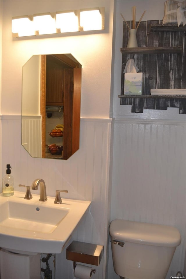 bathroom featuring sink and toilet