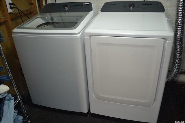 laundry room featuring separate washer and dryer