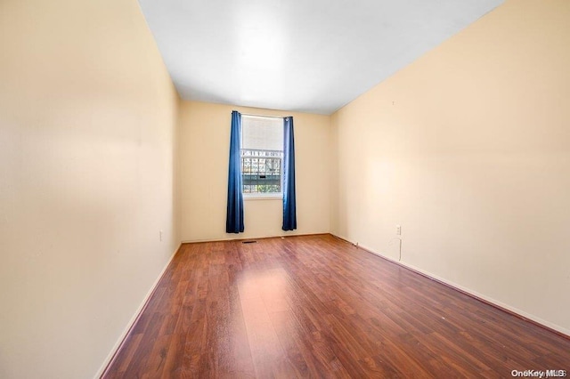 empty room featuring hardwood / wood-style floors