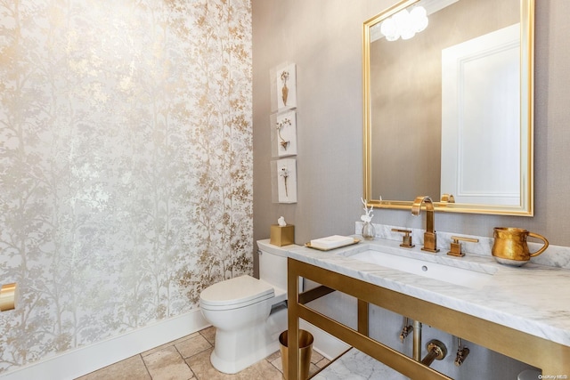 bathroom featuring tile patterned floors, toilet, and sink