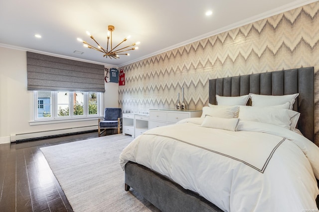 bedroom featuring dark wood-type flooring, ornamental molding, a notable chandelier, and a baseboard heating unit