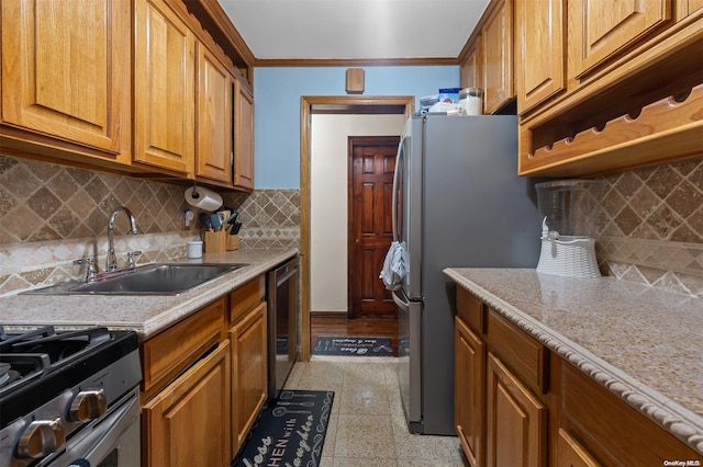 kitchen featuring crown molding, sink, tasteful backsplash, light stone counters, and stainless steel appliances