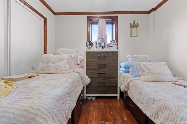 bedroom featuring crown molding and dark hardwood / wood-style flooring