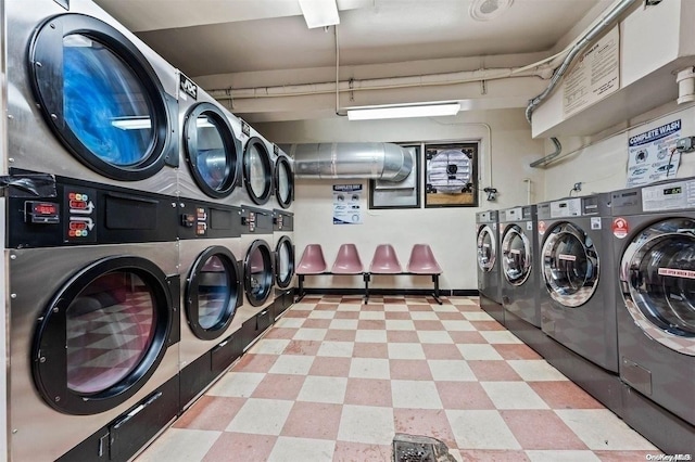 washroom with washing machine and clothes dryer