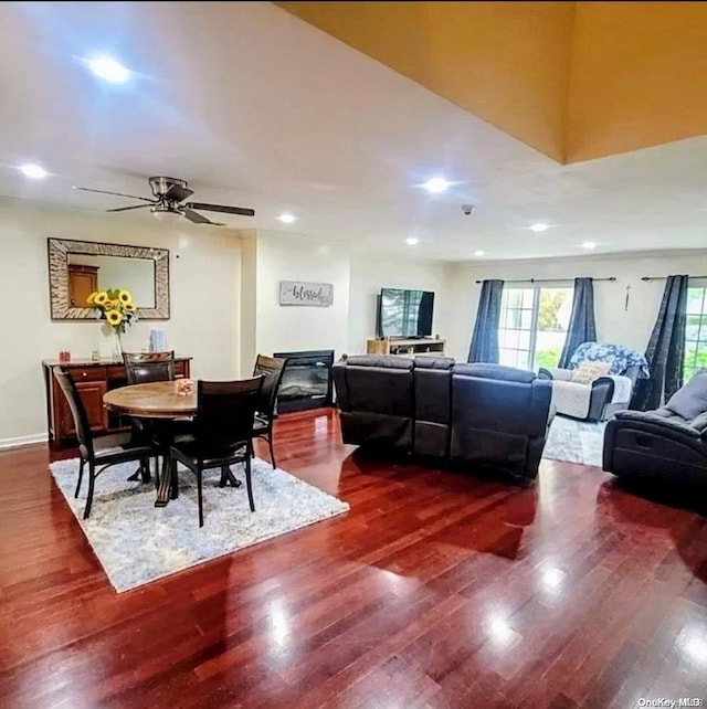 dining room featuring ceiling fan and dark hardwood / wood-style flooring