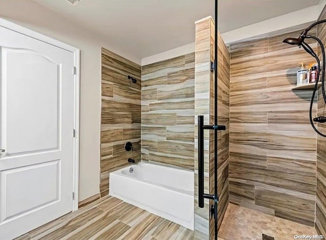 bathroom with shower with separate bathtub