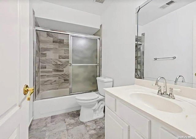 full bathroom with toilet, combined bath / shower with glass door, and vanity