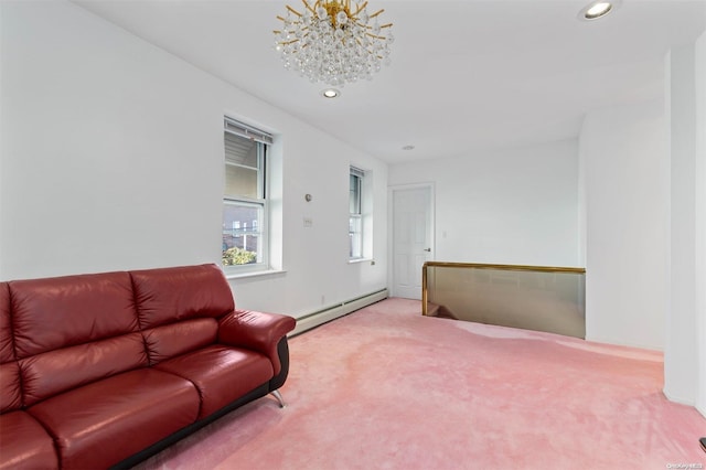 living room featuring carpet floors, baseboard heating, and a chandelier