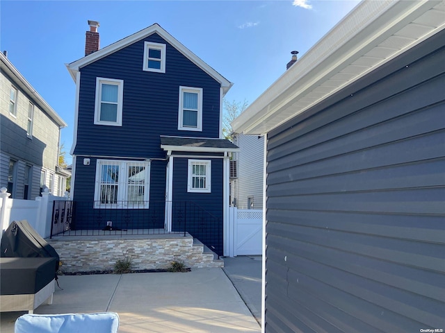 back of property with a patio area