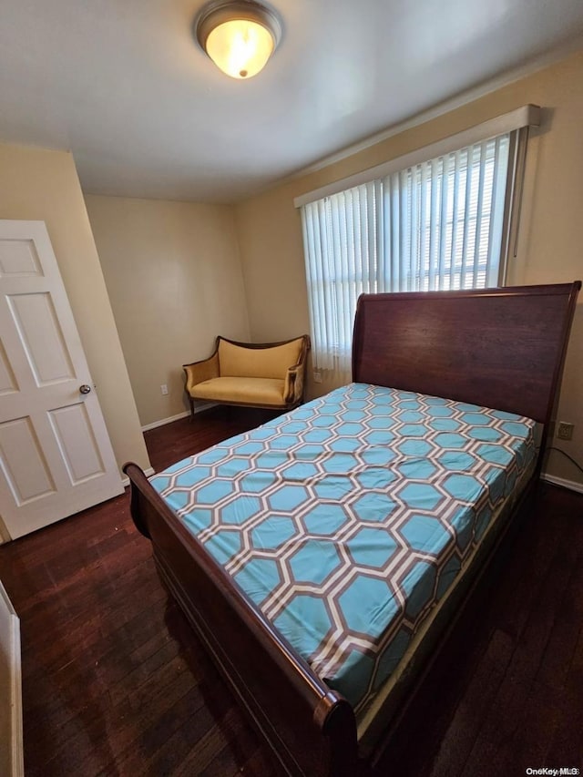 bedroom featuring dark wood-type flooring