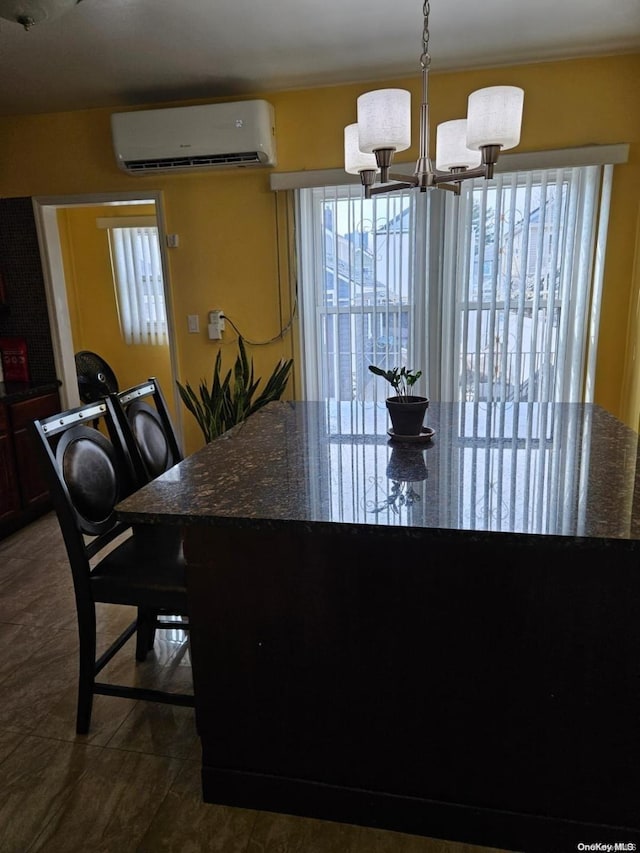 tiled dining room with a healthy amount of sunlight, an AC wall unit, and a chandelier