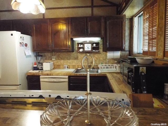 kitchen with white appliances and sink