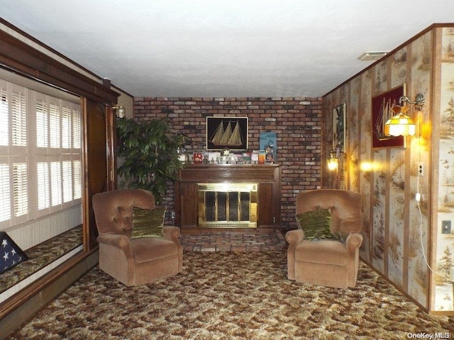 sitting room featuring wood walls, crown molding, carpet floors, and a fireplace