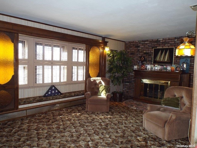 living room featuring a fireplace, ornamental molding, and brick wall