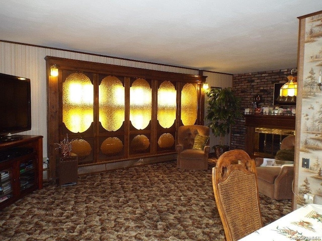 carpeted living room featuring ornamental molding and a fireplace