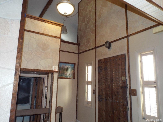 foyer featuring a towering ceiling