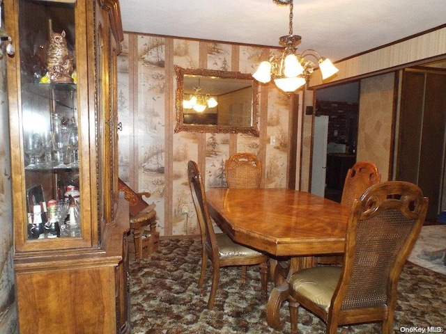 dining area featuring a notable chandelier and ornamental molding