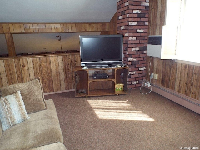 living room with carpet flooring, wooden walls, and vaulted ceiling