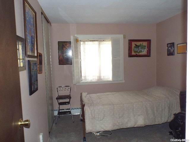 carpeted bedroom with a baseboard radiator